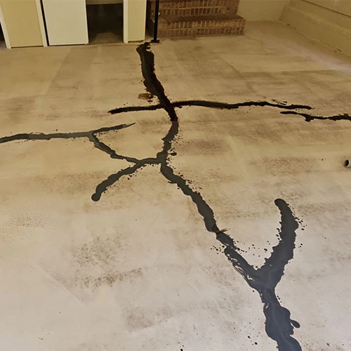 Concrete basement floor crack repair